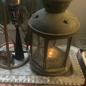 Lantern made of metal and glass that uses tea candle